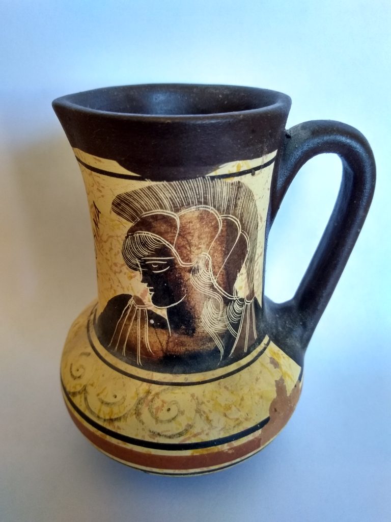A reproduction of an ancient pitcher depicting Athena.